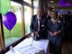 Paul Stewart, Chair and Tracey Cannel, CEO cutting a birthday cake celebrating ECCH's 1st birthday