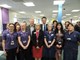 Francis Maude visiting ECCH HQ posing for picture with staff