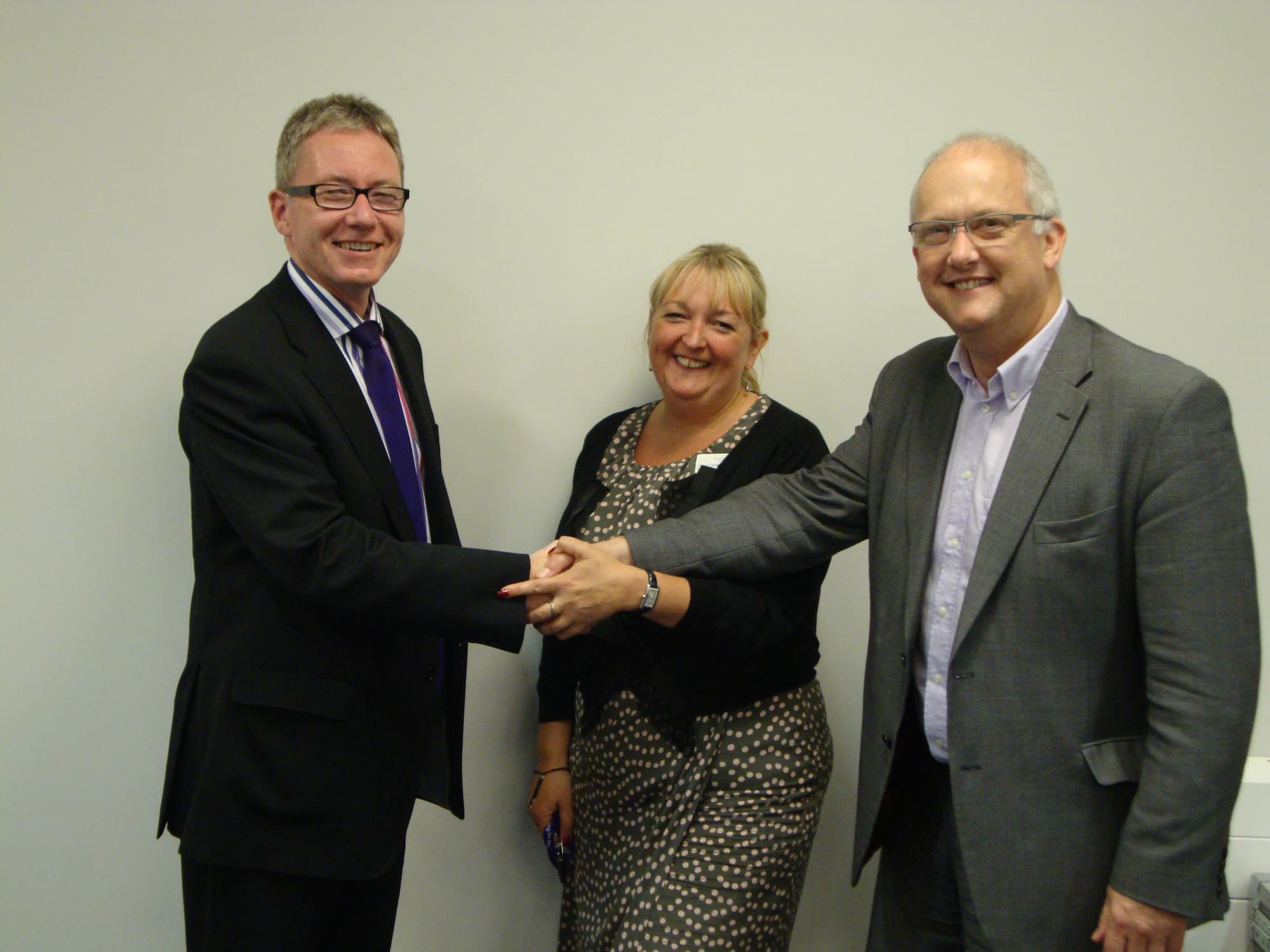 Shaking hands after signing contract