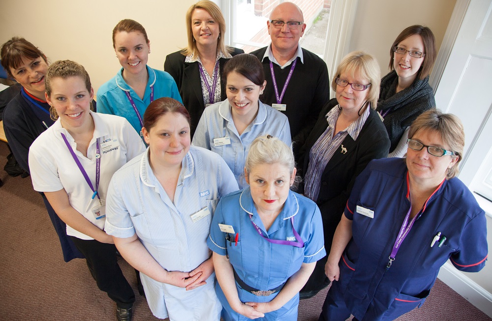 A selection of staff posing for picture