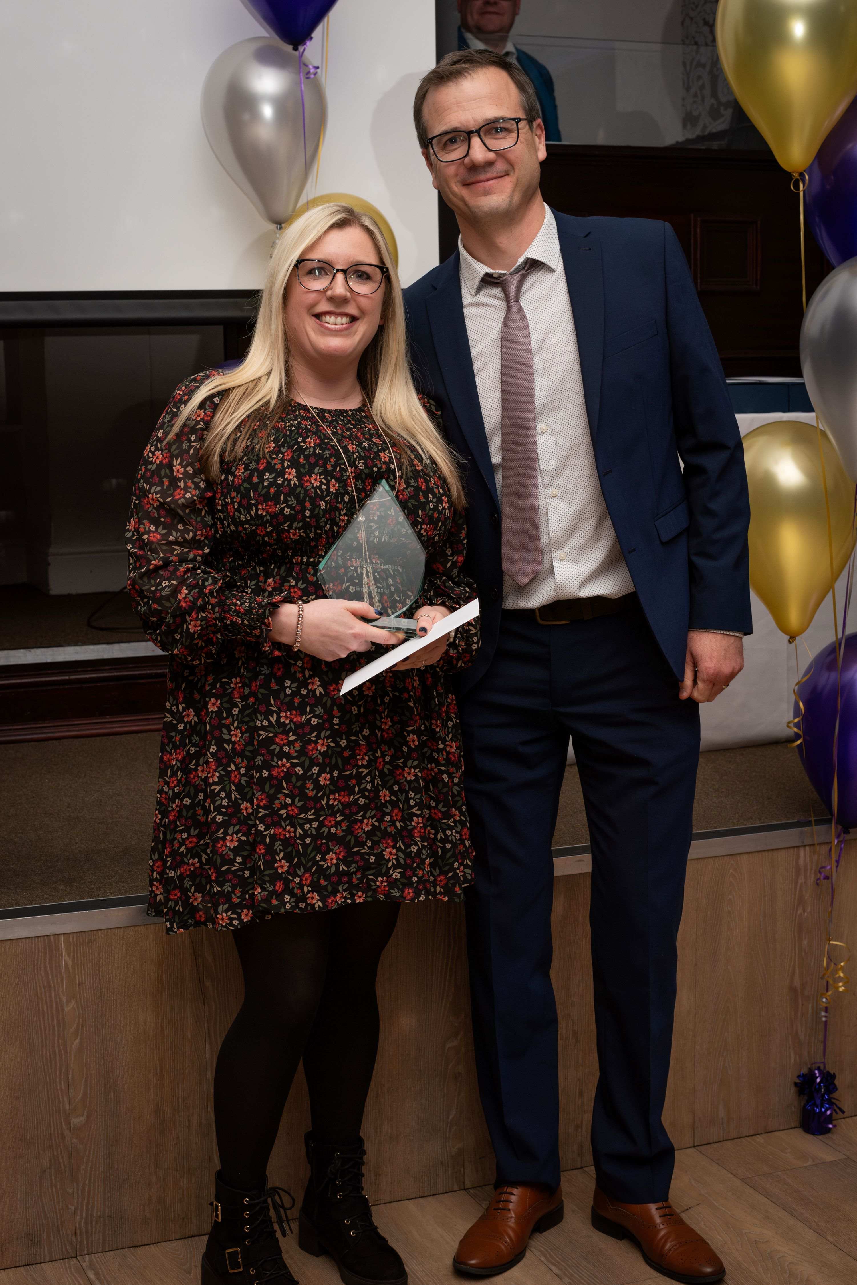 Emma Beard & Ben Parish Holding the Award
