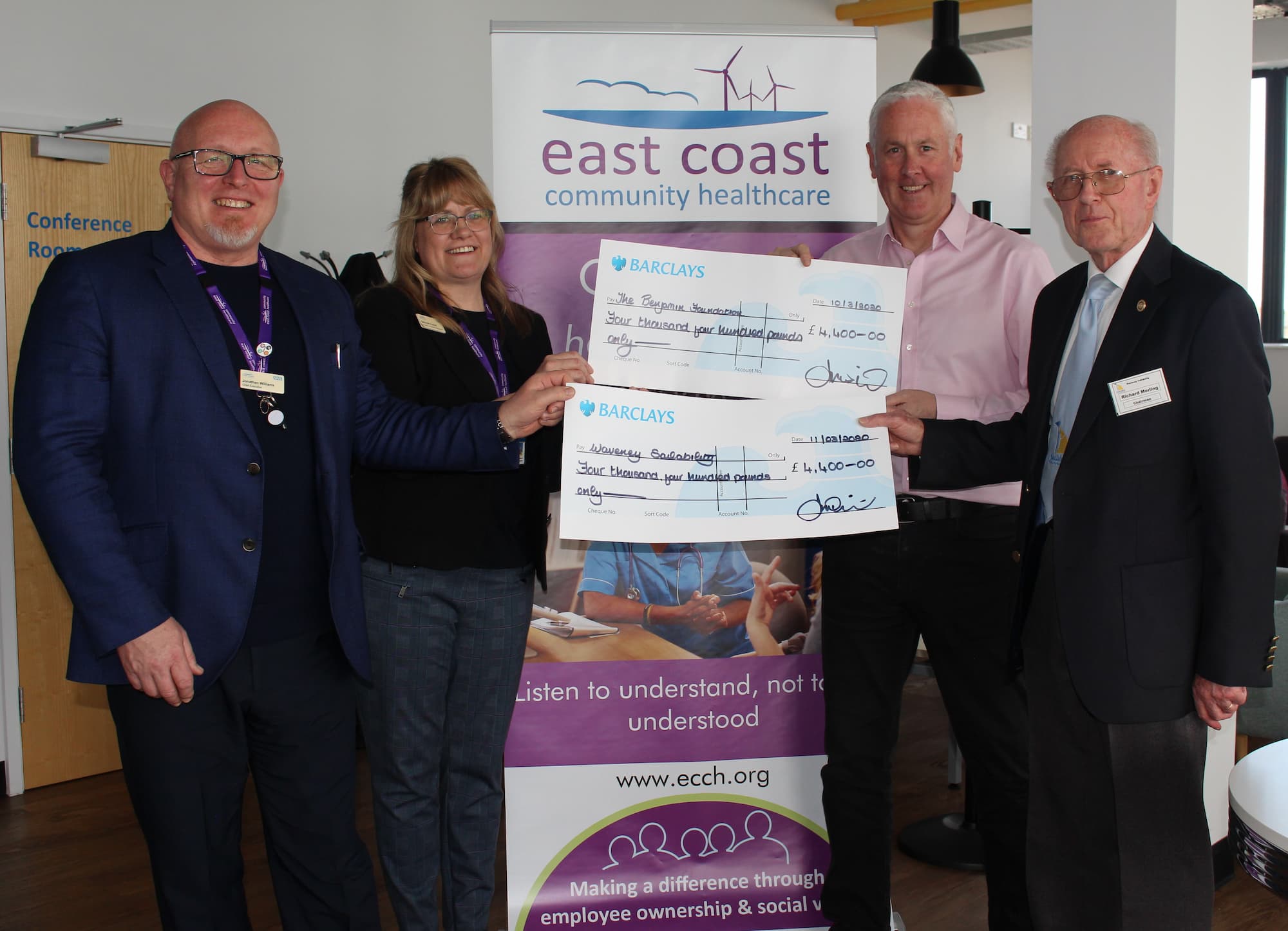 ECCH CEO and HR Director presenting cheques