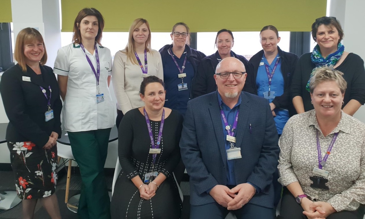 a selection of ECCH Staff smiling after winning our contract